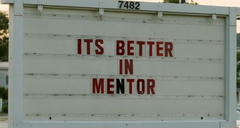 A sign with the slogan of Mentor, Ohio.