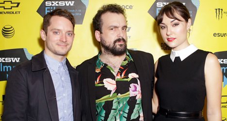 (From left) Actor Elijah Wood, filmmaker Nacho Vigalondo and actress Sasha Grey on the red carpet at the 2014 SXSW Film Festival for the debut of their new film "Open Windows."